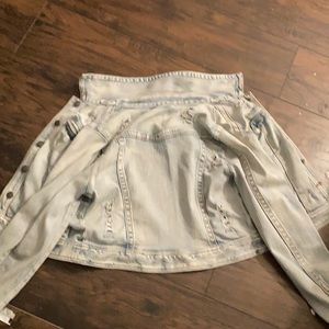 A jean jacket with sparkle, distressed moments